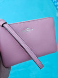Cartera Coach de mano