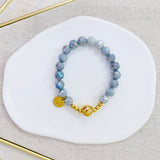 Pulsera gris,ola color oro