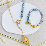 Cadena motivo de gota grande color oro,con bolitas gris