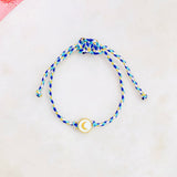 Pulsera de hilo ajustable. Motivo de luna