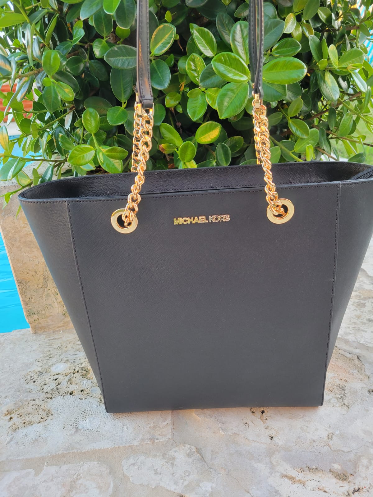 Cartera Michael kors,los mangos en forma de cadena.