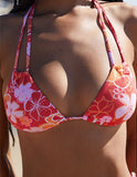 Top Roxy de bikini tricolor Tiki con flores de pradera