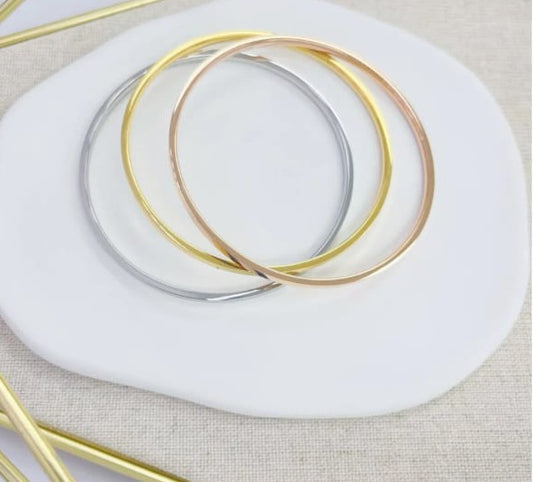 Trio de Pulseras Bangle Tres Tonos.  Stainless Steel